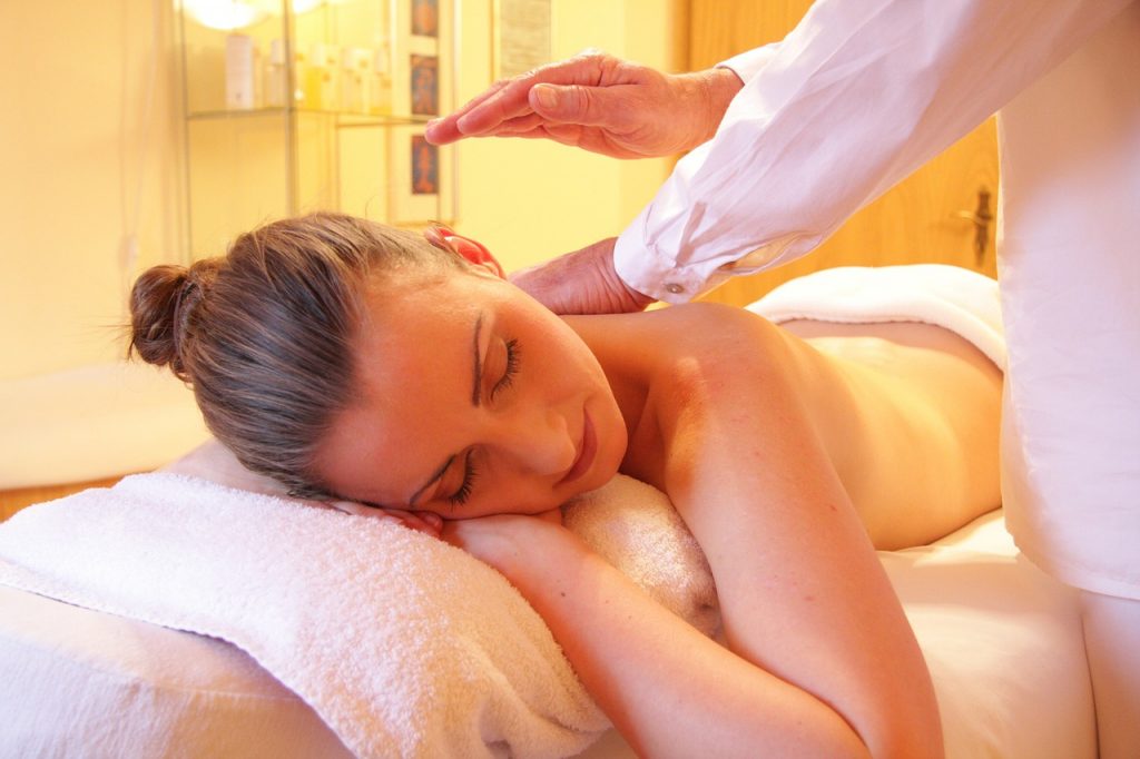 Woman relaxing during a Reiki treatment
